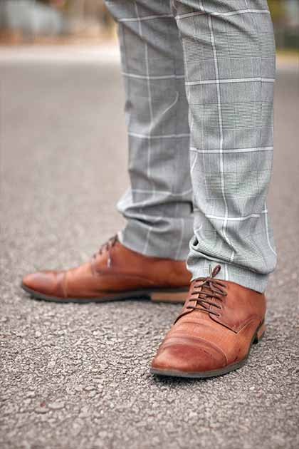 brown shoes with grey pants